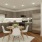 a kitchen with a dining table and chairs